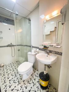 a bathroom with a toilet and a sink at Joy Homestay in Hanoi