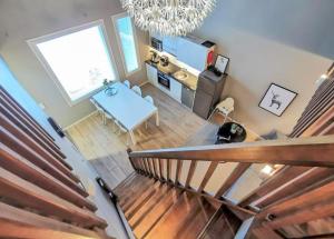 an overhead view of a living room and a kitchen with a table at Aurinkorinne 2 - Modern 2BD & Loft, free wifi & sauna in Syöte