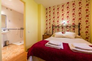 Postel nebo postele na pokoji v ubytování Hotel Rural Somiedo