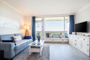 TV a/nebo společenská místnost v ubytování Timmendorfer Strand-Apartment