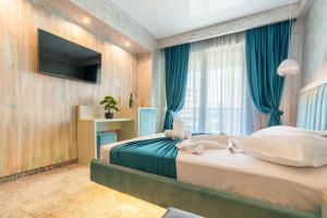 Postel nebo postele na pokoji v ubytování HOTEL KALYA + 37 fotografií