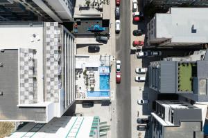 an overhead view of a city street with parked cars at HOTEL KALYA in Năvodari
