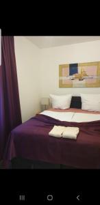 a bed with two towels sitting on top of it at Design Apartments Tomelana in Ličko Petrovo Selo +27 photos