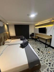 HOTEl AIRPORT PEREIRA客房内的一张或多张床位