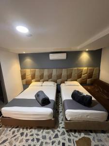 HOTEl AIRPORT PEREIRA客房内的一张或多张床位