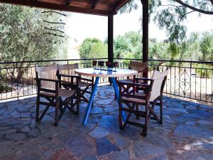 a table and chairs sitting on a patio at Nectar Cottages in Varákkes