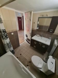 a bathroom with a tub and a toilet and a sink at The Hammam Guest House in Nydri +12 photos