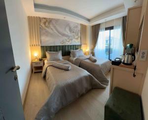 Voodi või voodid majutusasutuse Datca Suites Luxury Boutuiqe Hotel toas