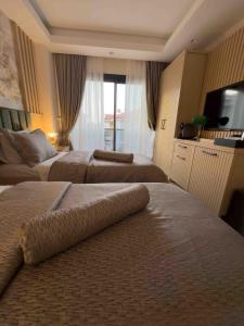Voodi või voodid majutusasutuse Datca Suites Luxury Boutuiqe Hotel toas