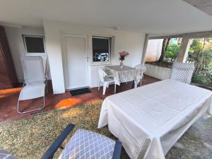 a living room with a table and chairs at Apartment Krasici in Krašići