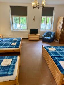Postel nebo postele na pokoji v ubytování Apartmán Na návsi