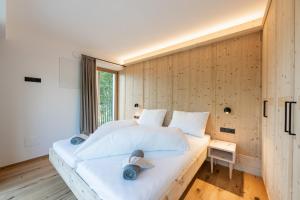Postel nebo postele na pokoji v ubytování Appartements zi Ranna