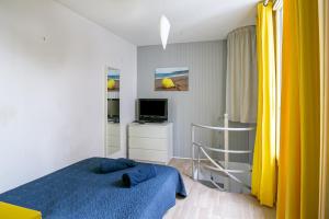 Ένα ή περισσότερα κρεβάτια σε δωμάτιο στο La Maisonnette de la Plage - À 50m de la plage