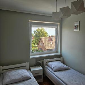 Posteľ alebo postele v izbe v ubytovaní BRZEŹNO nr 5