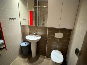 a small bathroom with a toilet and a sink at Apartment Aurea in Makarska +12 photos