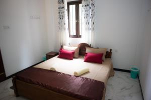 Giường trong phòng chung tại Sun Lanka Hikkaduwa