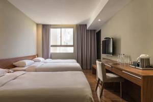 Ένα ή περισσότερα κρεβάτια σε δωμάτιο στο 河堤漫旅-自立館River inn Zili +40 φωτογραφίες