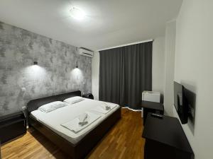 Voodi või voodid majutusasutuse Apartments Philip II toas