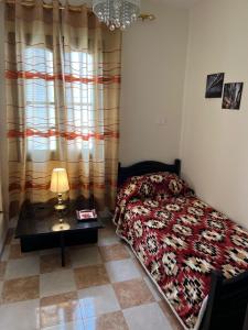Postel nebo postele na pokoji v ubytování Étage de villa Yasmine
