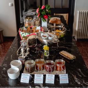 a long buffet of food on a table at L'écrin des Gaves in Hastingues