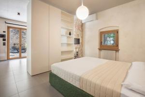 Ένα ή περισσότερα κρεβάτια σε δωμάτιο στο Residenza Vedovelli