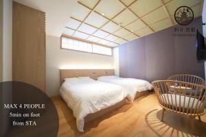 Postel nebo postele na pokoji v ubytování 利々 京都 lili hotel kyoto