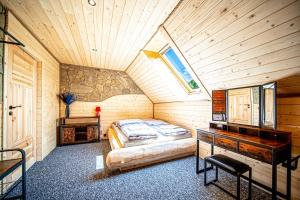 a bedroom with a bed in a wooden cabin at Trzy Kopce in Ropica Dolna +157 photos