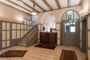a hallway with a staircase and a door in a building at Villa Irena in Sopot