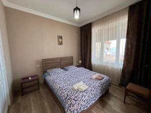 Postelja oz. postelje v sobi nastanitve Guest House Aisi