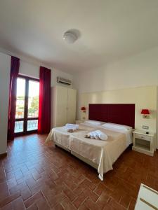 Postel nebo postele na pokoji v ubytování TC HOTEL