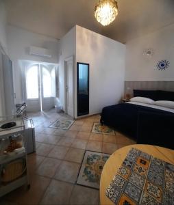 Postel nebo postele na pokoji v ubytování La casa delle Camelie