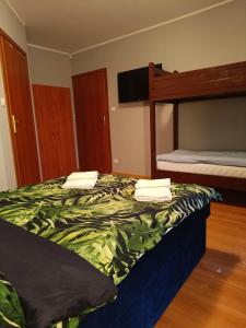 Postel nebo postele na pokoji v ubytování Bursztynowa 2