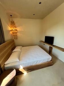 Postel nebo postele na pokoji v ubytování Casa Boha