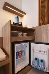 a kitchen with an open refrigerator with drinks in it at Inmood Aucanada 4 Sup in Port d'Alcudia
