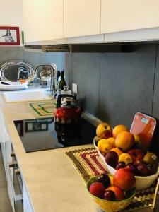 a bowl of fruit on a counter in a kitchen at Fior di Loto in Ravenna