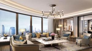 a living room with a couch and a table at InterContinental Bangkok by IHG in Bangkok