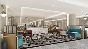 a lobby with chairs and a table in a building at InterContinental Bangkok by IHG in Bangkok