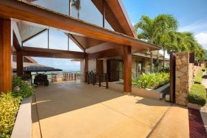 an external view of a house with a patio at Baan Grand Vista - Panoramic Sea View 5 Bed Pool Villa in Bophut 