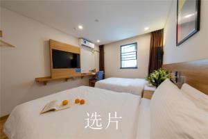 Letto o letti in una camera di 趣创酒店