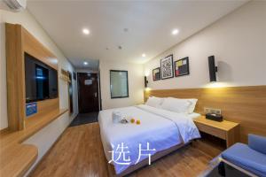 Letto o letti in una camera di 趣创酒店