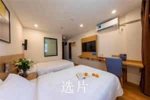 Letto o letti in una camera di 趣创酒店