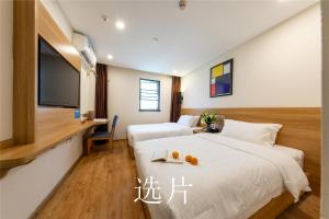 Letto o letti in una camera di 趣创酒店