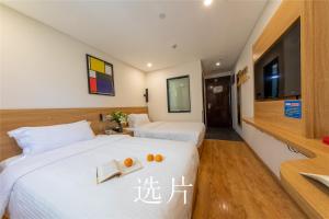 Letto o letti in una camera di 趣创酒店