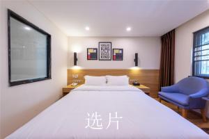 Letto o letti in una camera di 趣创酒店