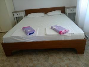 Postel nebo postele na pokoji v ubytování Rony Hotel