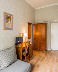 a room with a desk with a computer and a bed at Villa Irena in Sopot +29 photos