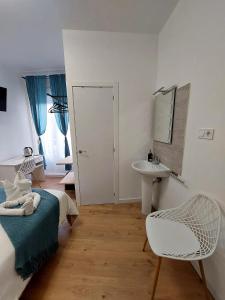 Łóżko lub łóżka w pokoju w obiekcie Habitaciones Universal