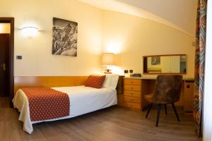 Postel nebo postele na pokoji v ubytování Hotel Bouton d'Or - Courmayeur