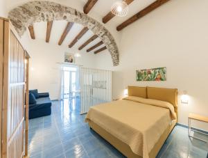 Postel nebo postele na pokoji v ubytování Archi Suite Canneto