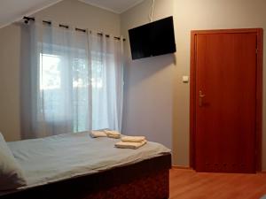Postel nebo postele na pokoji v ubytování Bursztynowa 2